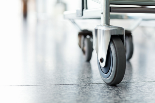 Close up of industrial trolley wheel and castor.